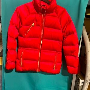 Red puffy jacket great for skiing